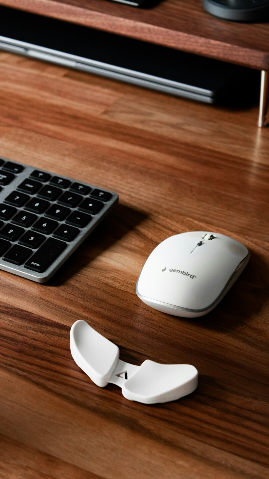 Flat-lay of a keyboard, mouse and notebook on a desk