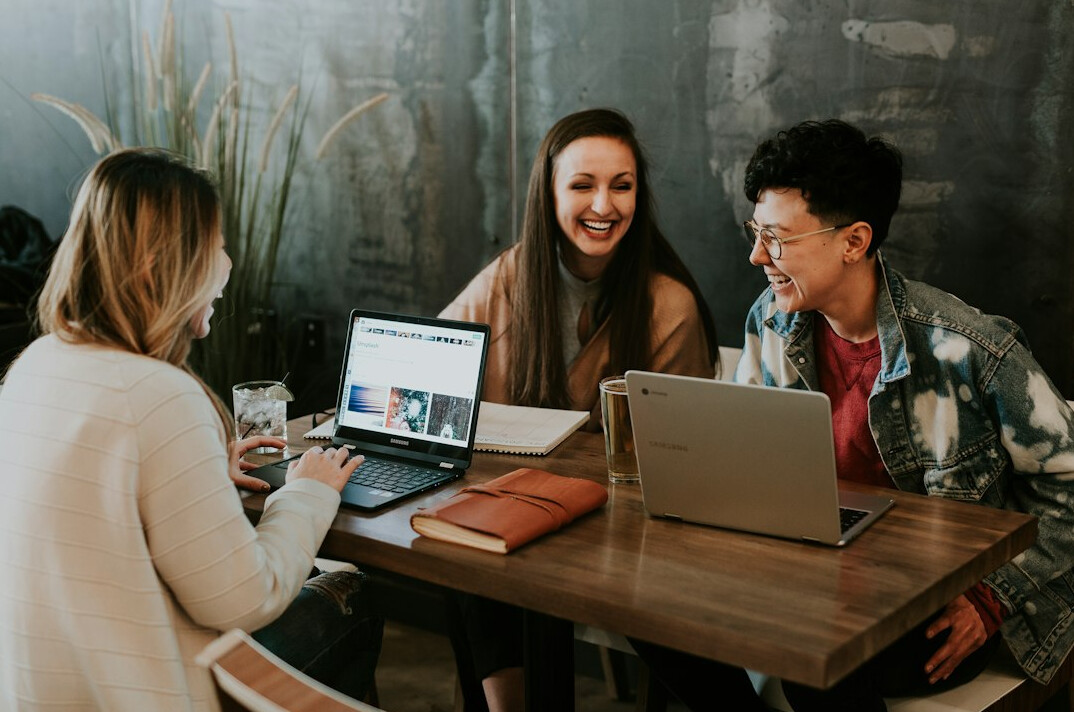 group of friends coding together