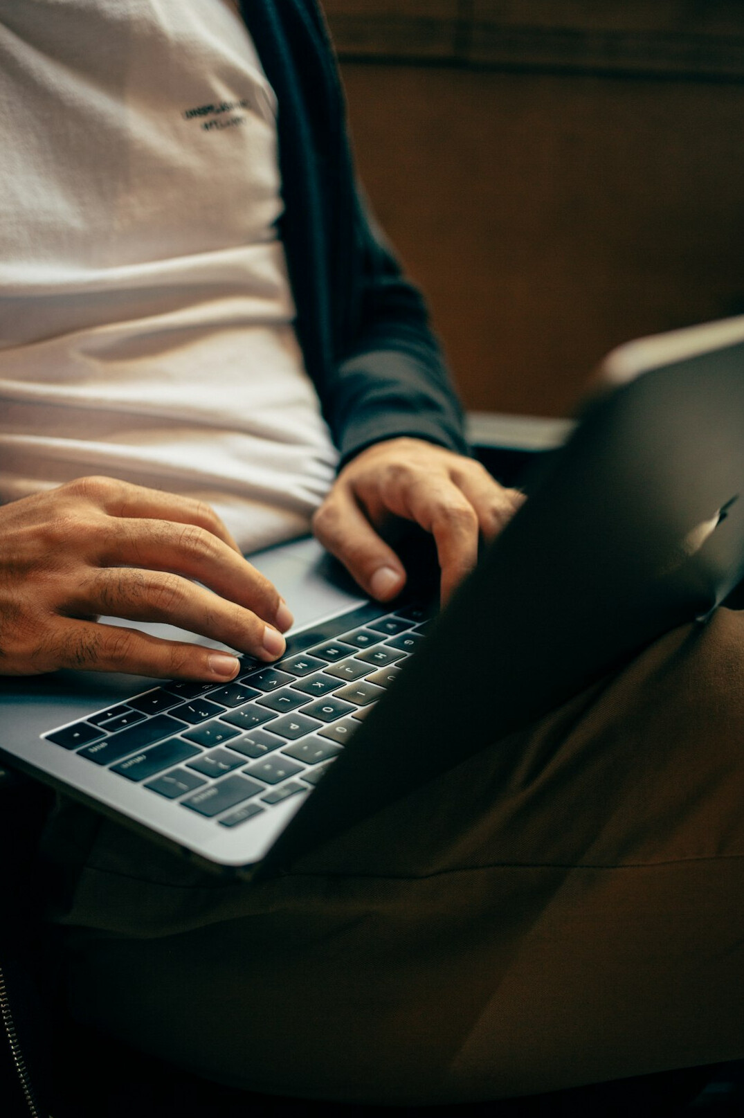 person typing on laptop
